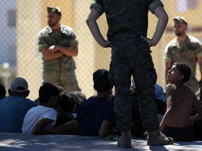 Did Morocco allow thousands of migrants to cross into a Spanish enclave, and if so, why?